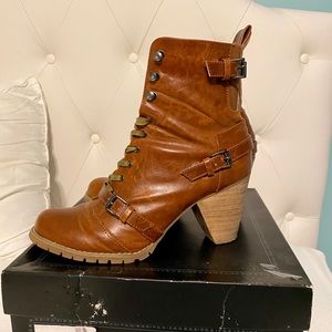 Brown lace up boots with low heel and side buckles